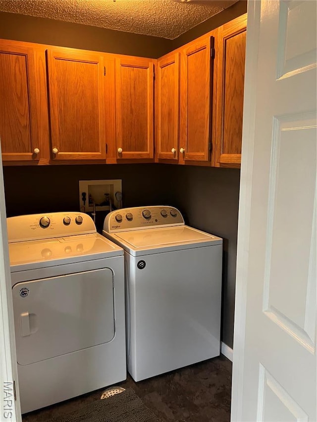 303 Greenbriar, Rolla, MO 65401 - clothes washing area with cabinet space and washing machine and clothes dryer