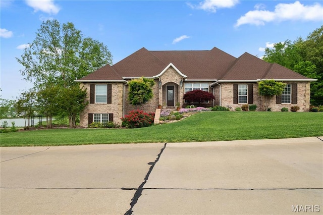 317 Whispering Oaks Cpe, Girardeau, MO 63701 - view of front of property with brick siding and a front lawn