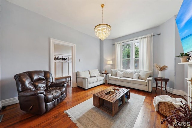 2116 Victor St, Saint Louis, MO 63104 - living area with a chandelier, hardwood / wood-style floors, and baseboards