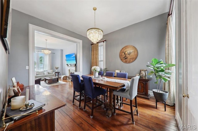 2116 Victor St, Saint Louis, MO 63104 - dining room featuring a chandelier and hardwood / wood-style flooring