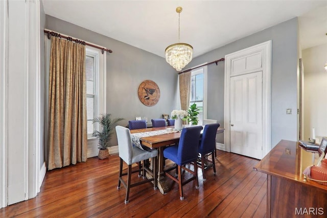 2116 Victor St, Saint Louis, MO 63104 - dining area with a chandelier, dark wood finished floors, and baseboards