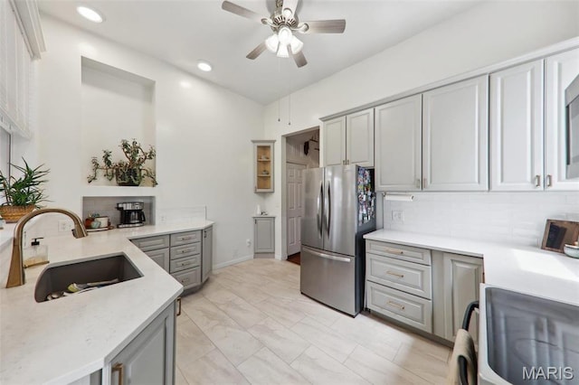2116 Victor St, Saint Louis, MO 63104 - kitchen featuring freestanding refrigerator, a sink, gray cabinetry, stove, and a ceiling fan