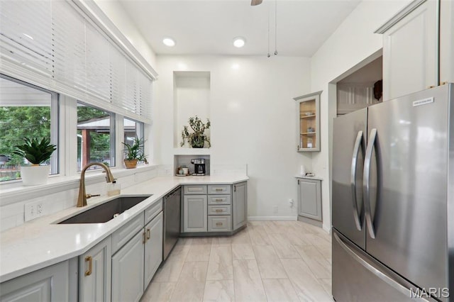 2116 Victor St, Saint Louis, MO 63104 - kitchen featuring freestanding refrigerator, gray cabinetry, a sink, dishwasher, and light countertops