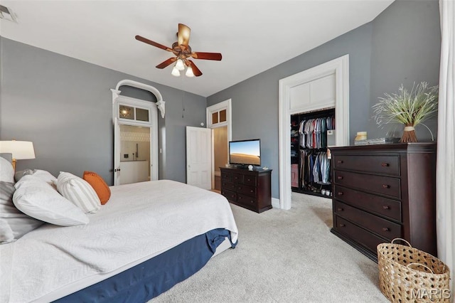 2116 Victor St, Saint Louis, MO 63104 - bedroom featuring light colored carpet, a closet, a spacious closet, and a ceiling fan