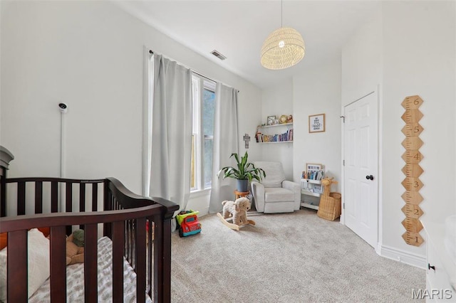 2116 Victor St, Saint Louis, MO 63104 - bedroom with carpet and a crib