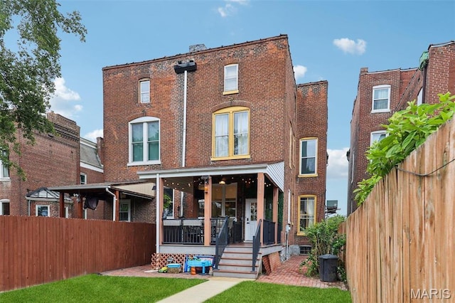 2116 Victor St, Saint Louis, MO 63104 - rear view of property with brick siding and covered porch