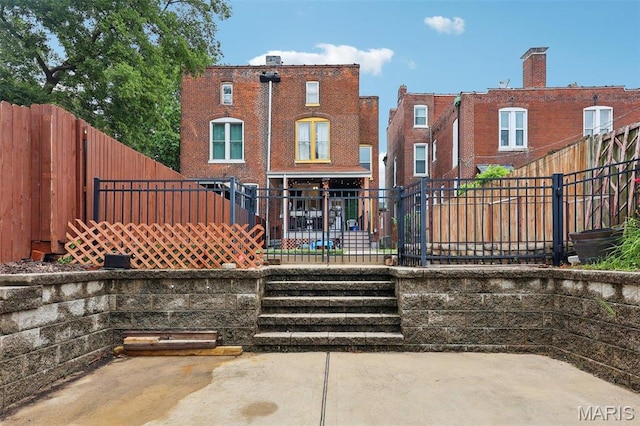 2116 Victor St, Saint Louis, MO 63104 - rear view of property with a patio and a fenced backyard