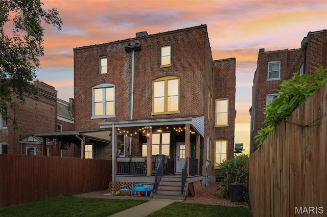 2116 Victor St, Saint Louis, MO 63104 - rear view of property with brick siding and covered porch