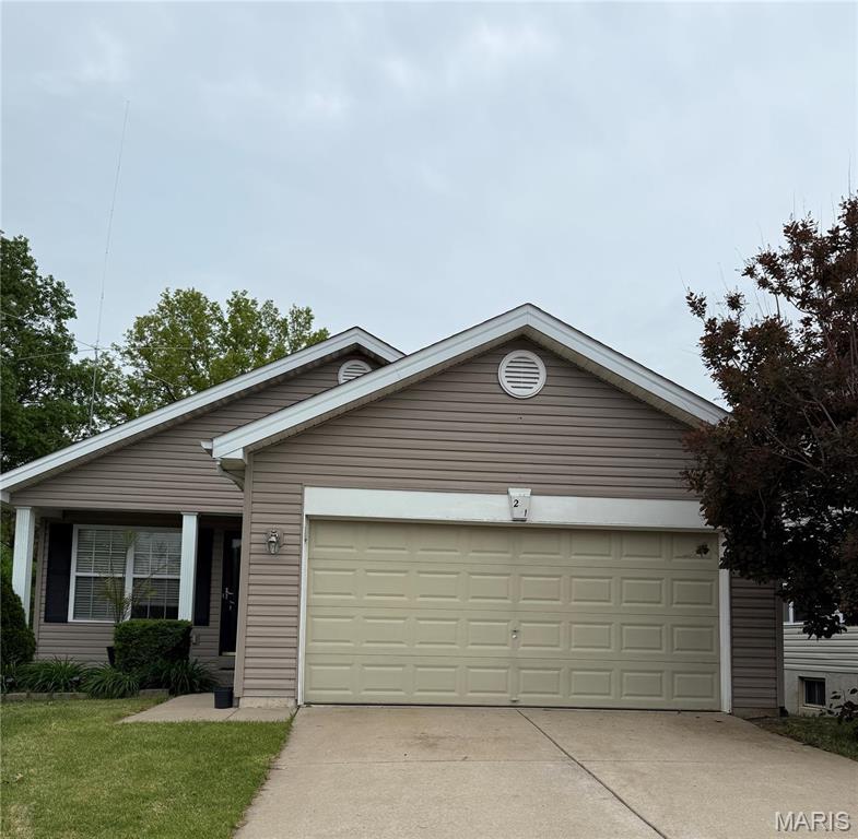 261 Almond Tree Dr, Troy, MO 63379 - ranch-style home with a garage, driveway, and a front lawn
