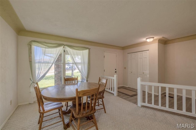 6344 Gibison Rd, Troy, MO 63379 - dining area with baseboards and a textured ceiling
