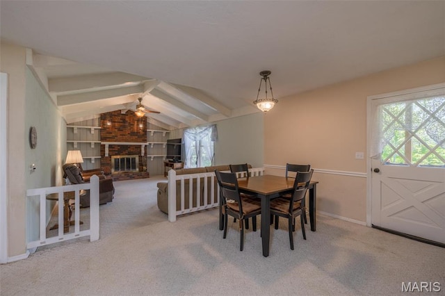 6344 Gibison Rd, Troy, MO 63379 - carpeted dining room featuring a ceiling fan, baseboards, and a brick fireplace