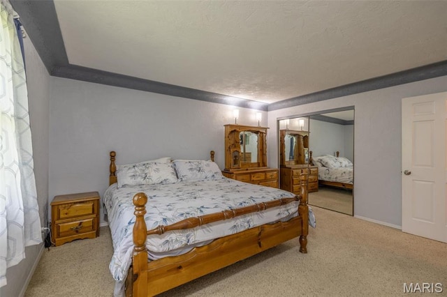 6344 Gibison Rd, Troy, MO 63379 - carpeted bedroom featuring a closet, a textured ceiling, and baseboards