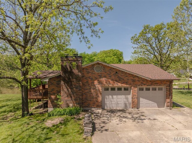 6344 Gibison Rd, Troy, MO 63379 - view of front of property with concrete driveway, a front yard, a garage, a chimney, and brick siding
