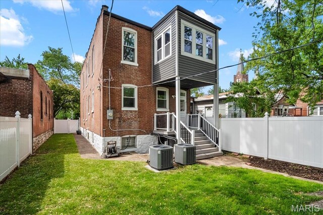 5518 Alaska Ave, Saint Louis, MO 63111 - rear view of house with brick siding and cooling unit