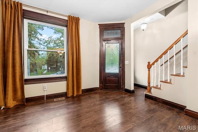 5518 Alaska Ave, Saint Louis, MO 63111 - foyer featuring wood finished floors, stairway, and baseboards