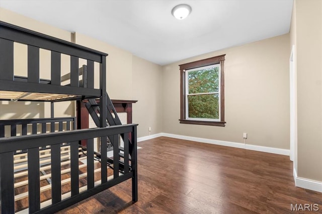 5518 Alaska Ave, Saint Louis, MO 63111 - bedroom featuring baseboards and wood finished floors