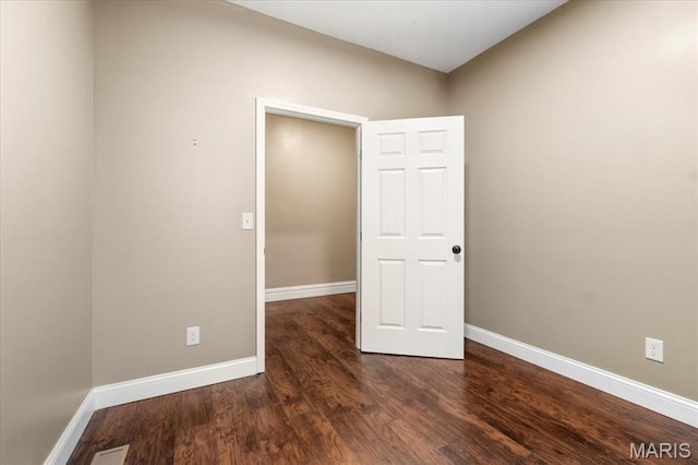 5518 Alaska Ave, Saint Louis, MO 63111 - spare room featuring wood finished floors and baseboards