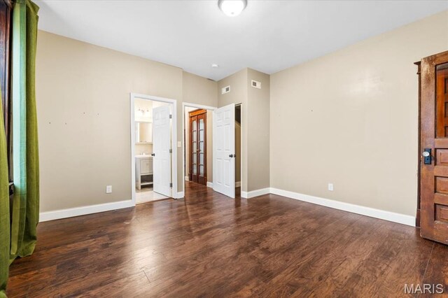 5518 Alaska Ave, Saint Louis, MO 63111 - unfurnished bedroom with wood finished floors and baseboards