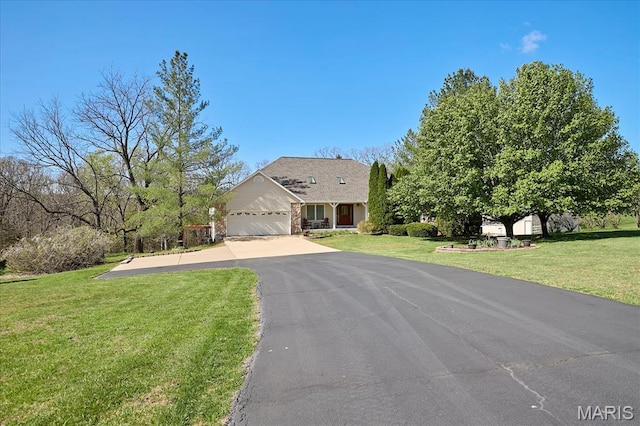 5026 Kype View Ave, Festus, MO 63028 - view of front of home featuring a garage, asphalt driveway, and a front yard