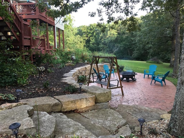 5026 Kype View Ave, Festus, MO 63028 - view of green lawn featuring an outdoor fire pit, a patio, a wooden deck, and stairs