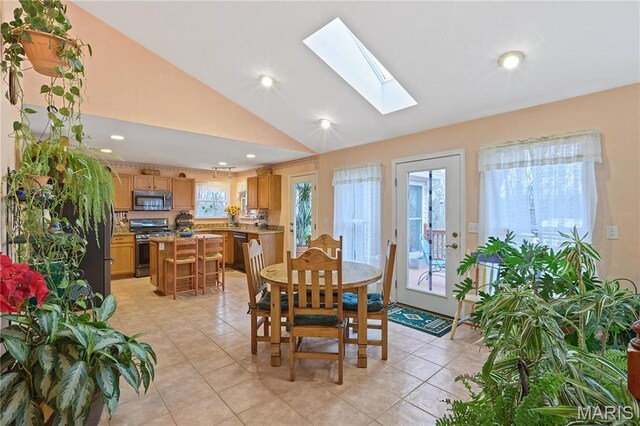 5026 Kype View Ave, Festus, MO 63028 - dining area with lofted ceiling, light tile patterned floors, a skylight, and recessed lighting