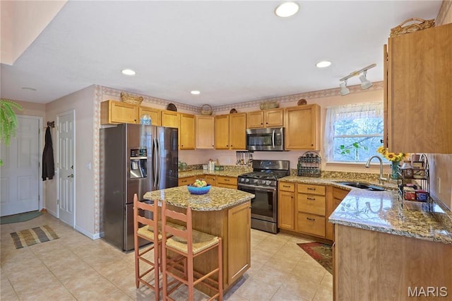 5026 Kype View Ave, Festus, MO 63028 - kitchen with appliances with stainless steel finishes, light stone countertops, a kitchen island, a breakfast bar area, and recessed lighting