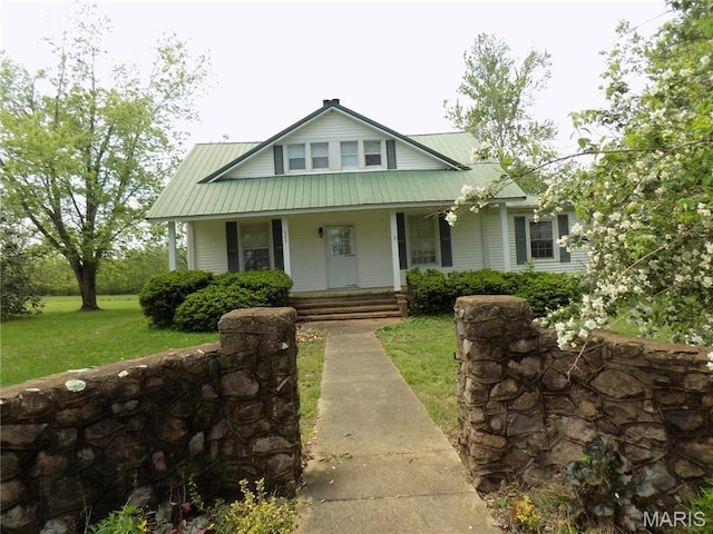 525 Russellville Rd, Arcadia, MO 63621 - view of front facade with a porch, a front lawn, and metal roof