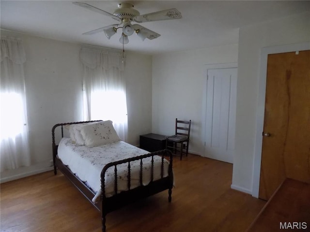 525 Russellville Rd, Arcadia, MO 63621 - bedroom with wood finished floors, ceiling fan, and baseboards