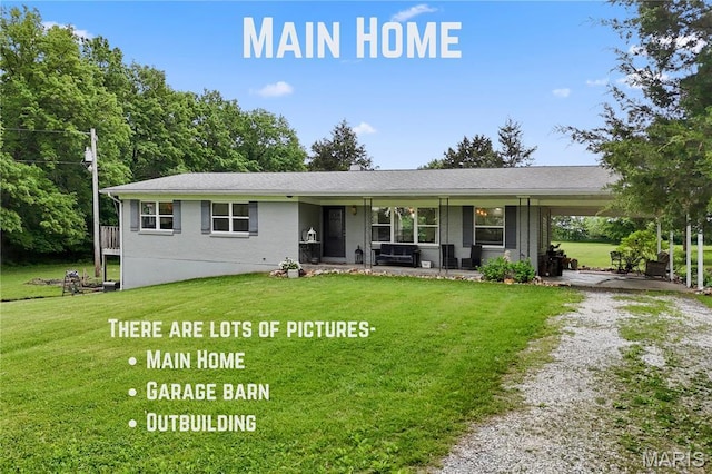 3066 W Meyer Rd, Foristell, MO 63348 - view of front facade with driveway, a front yard, a porch, and a carport