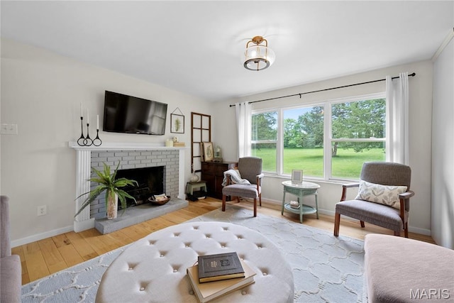 3066 W Meyer Rd, Foristell, MO 63348 - living room featuring wood finished floors and a brick fireplace