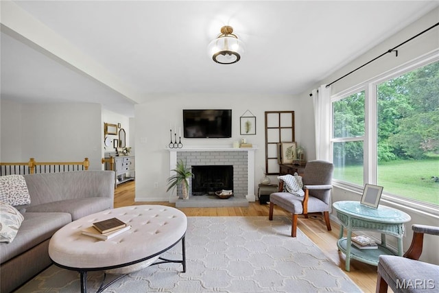 3066 W Meyer Rd, Foristell, MO 63348 - living room featuring wood finished floors and a brick fireplace