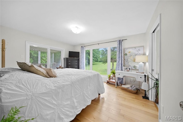 3066 W Meyer Rd, Foristell, MO 63348 - bedroom with wood-type flooring and access to exterior