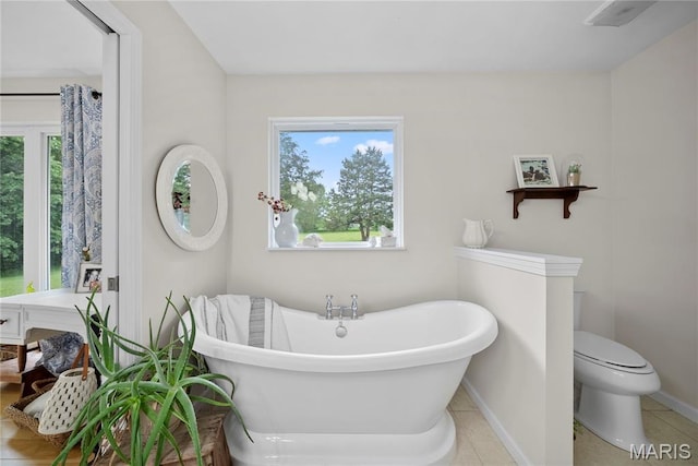 3066 W Meyer Rd, Foristell, MO 63348 - full bath featuring a freestanding tub, plenty of natural light, and tile patterned flooring