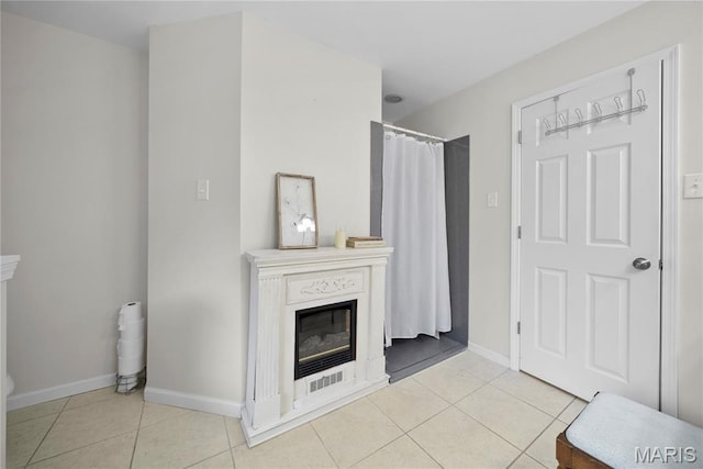 3066 W Meyer Rd, Foristell, MO 63348 - living room with a glass covered fireplace and light tile patterned floors