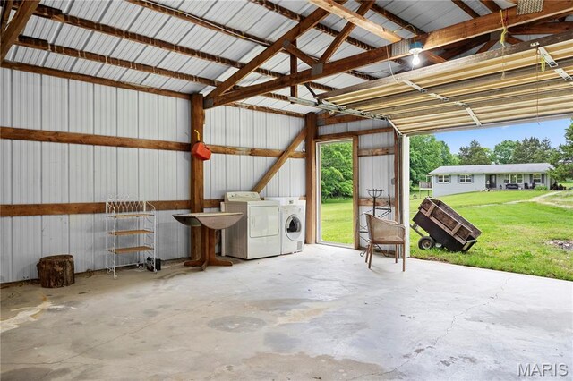 3066 W Meyer Rd, Foristell, MO 63348 - garage featuring washer and clothes dryer and metal wall