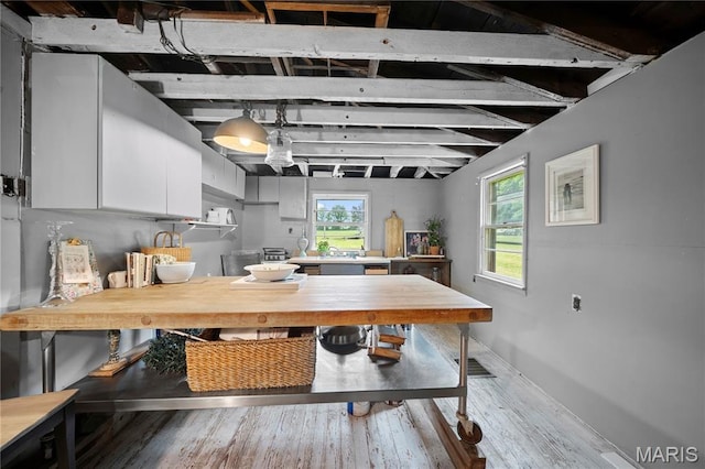 3066 W Meyer Rd, Foristell, MO 63348 - kitchen with white cabinetry and wood finished floors