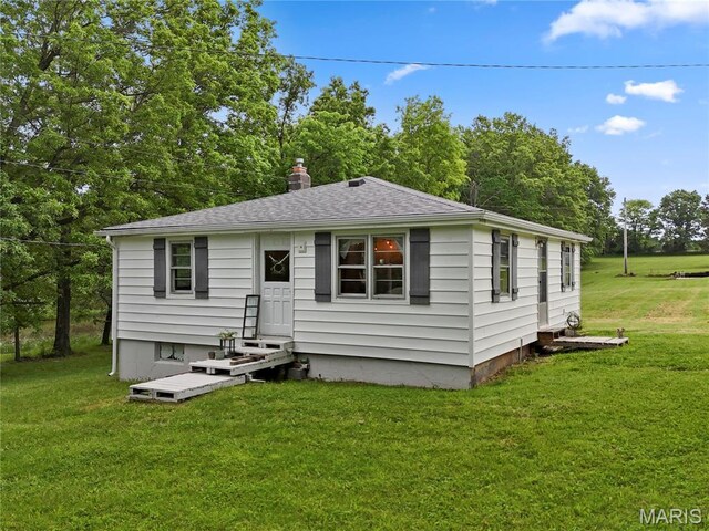 3066 W Meyer Rd, Foristell, MO 63348 - rear view of property with a yard, entry steps, a chimney, and a shingled roof