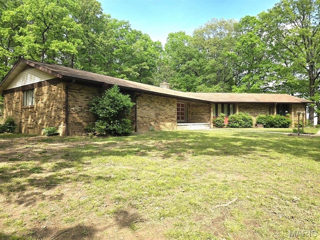 16043 County Road 624, Dexter, MO 63841 - ranch-style house featuring a front yard, a chimney, and brick siding