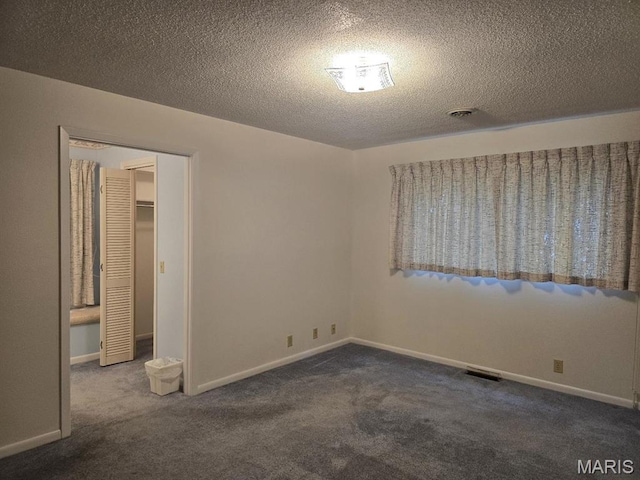 16043 County Road 624, Dexter, MO 63841 - carpeted spare room featuring a textured ceiling and baseboards