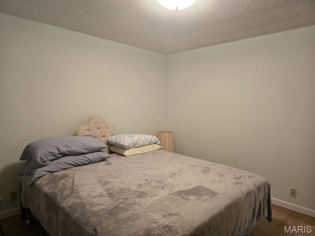 16043 County Road 624, Dexter, MO 63841 - bedroom with baseboards and dark wood-style floors
