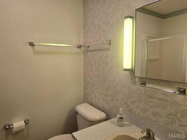 16043 County Road 624, Dexter, MO 63841 - bathroom featuring toilet, wallpapered walls, an enclosed shower, and vanity
