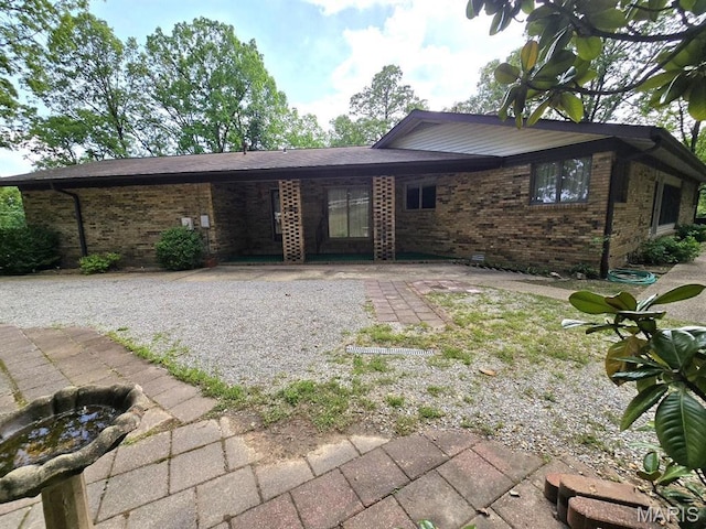16043 County Road 624, Dexter, MO 63841 - back of property featuring brick siding and a patio area