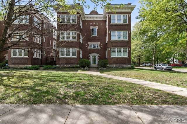 2056 Lafayette Ave Unit 1W, Saint Louis, MO 63104 - view of front of house featuring a front yard and brick siding