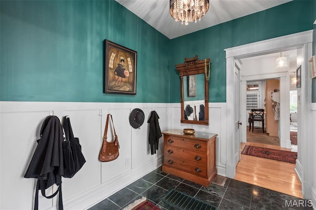 2056 Lafayette Ave Unit 1W, Saint Louis, MO 63104 - mudroom with a chandelier, wainscoting, and a decorative wall