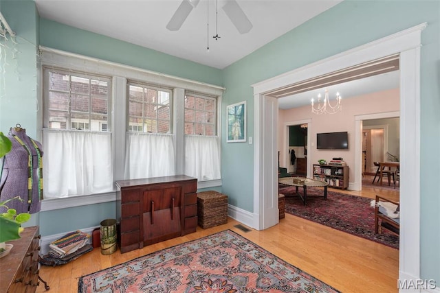 2056 Lafayette Ave Unit 1W, Saint Louis, MO 63104 - sitting room featuring wood finished floors, a chandelier, and plenty of natural light