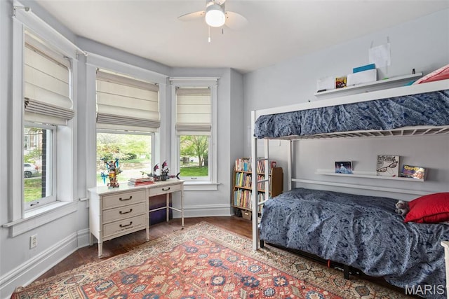 2056 Lafayette Ave Unit 1W, Saint Louis, MO 63104 - bedroom featuring baseboards, wood finished floors, multiple windows, and an office area