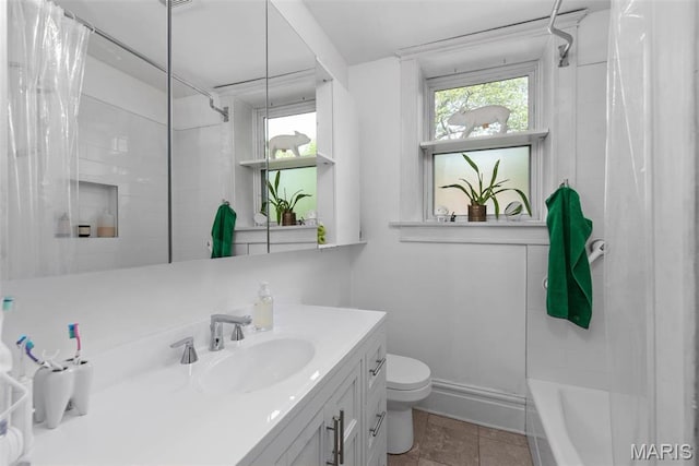 2056 Lafayette Ave Unit 1W, Saint Louis, MO 63104 - full bath featuring toilet, vanity, tile patterned floors, and shower / tub combo