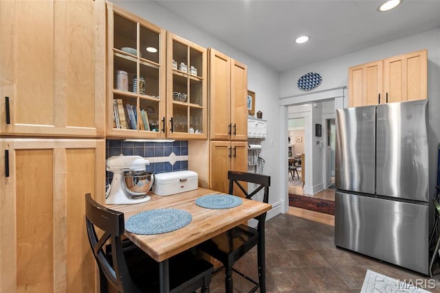 2056 Lafayette Ave Unit 1W, Saint Louis, MO 63104 - kitchen with freestanding refrigerator, light brown cabinetry, glass insert cabinets, recessed lighting, and decorative backsplash