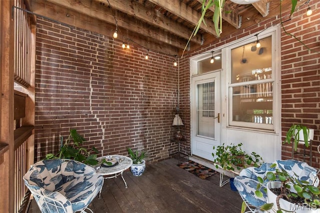 2056 Lafayette Ave Unit 1W, Saint Louis, MO 63104 - property entrance featuring brick siding and a wooden deck