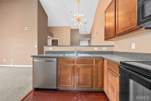 1131 Saravalle Dr, Saint Peters, MO 63376 - kitchen featuring stainless steel dishwasher, a sink, brown cabinets, black microwave, and a chandelier